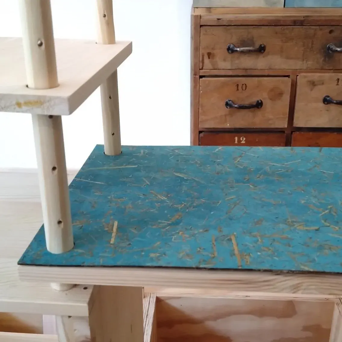 A Regenerative Modular Cabinet in daily use, its shelves filled with everyday things